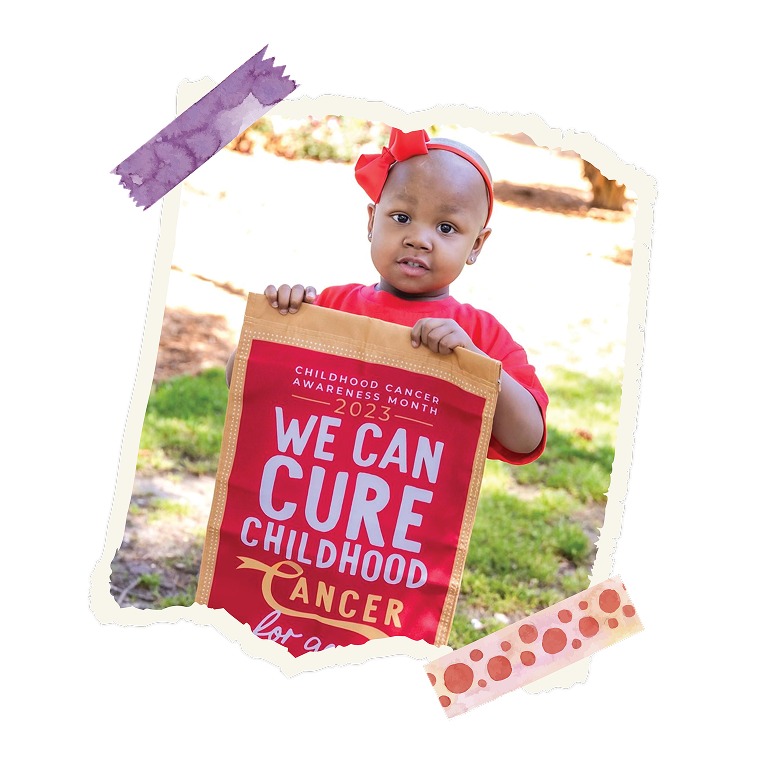 Three children in red CURE shirts holding awareness signs